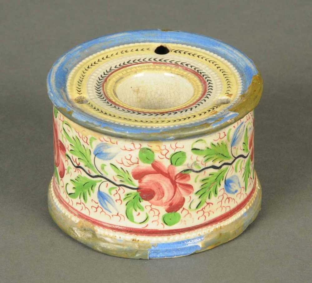 A William Fifield of Bristol circular inkwell, with three quill holes, decorated with roses, late