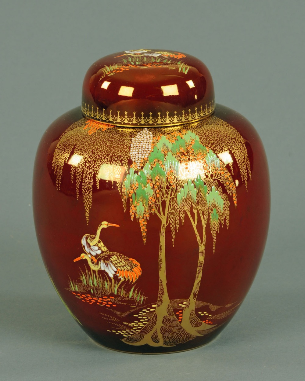 A Carltonware Rouge Royale lidded ginger jar, decorated with birds and foliage, printed mark to