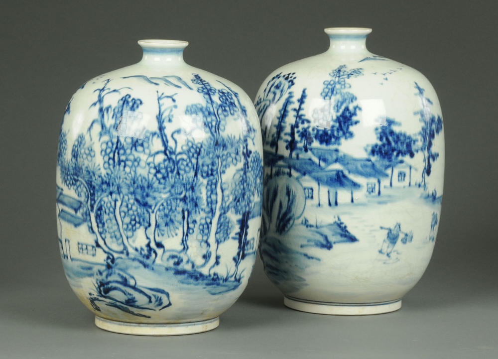 A pair of Chinese bulbous vases, blue and white, with four character mark to base.  Height 12 ins.