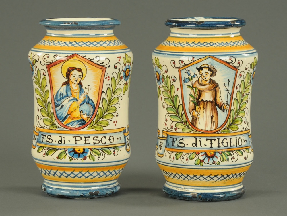 A pair of 17th century style Italian Majolica Albarelli, decorated in typical colours.  Height 9 ins