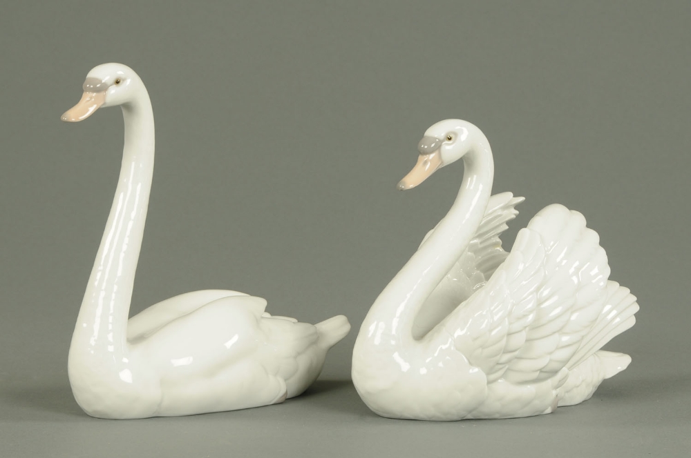 Two Lladro swans, both boxed.  Heights 9 ins and 7 ins.