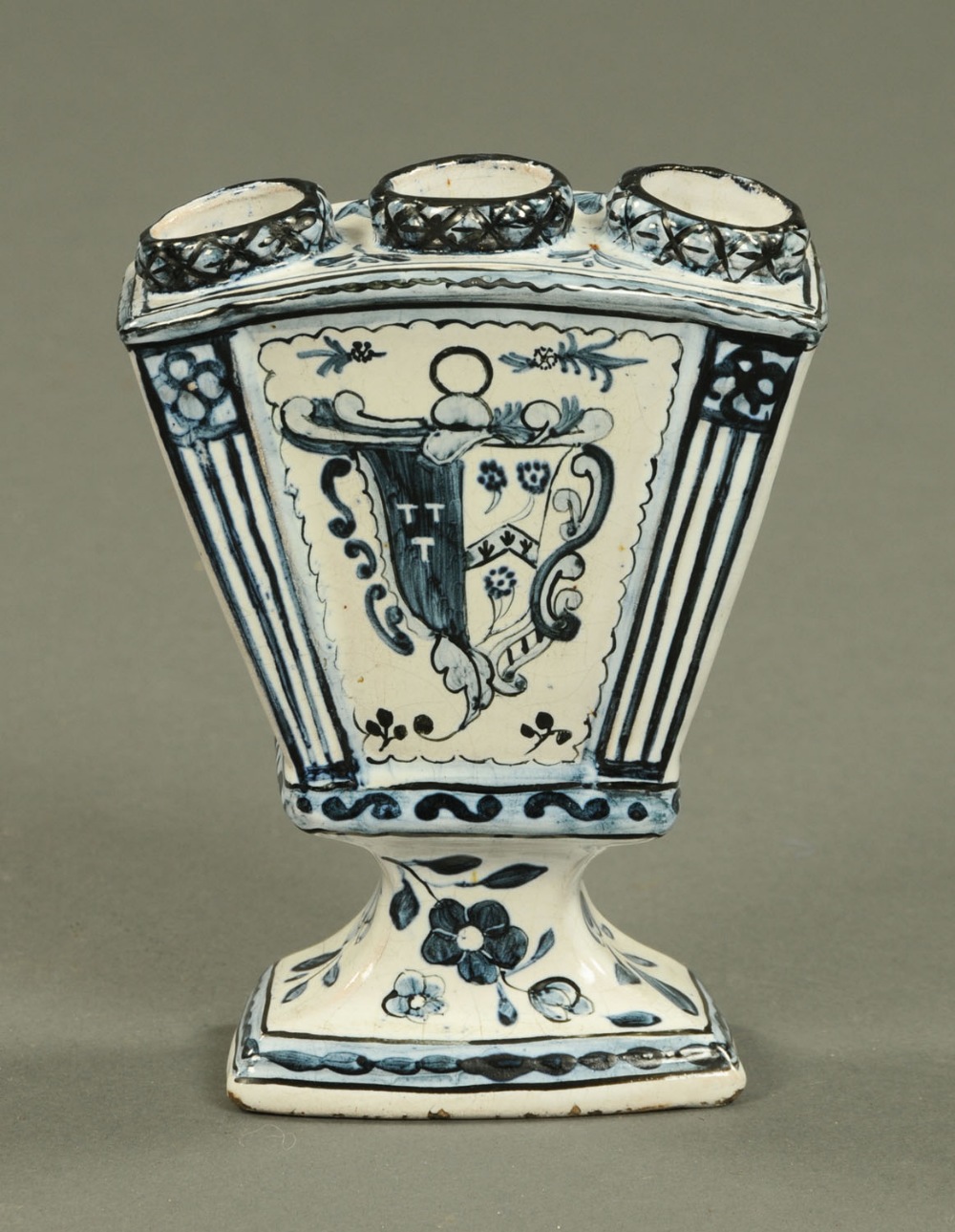 An 18th century Delft tulip vase, with armorial to front, circa 1790.  Height 6 ins (see