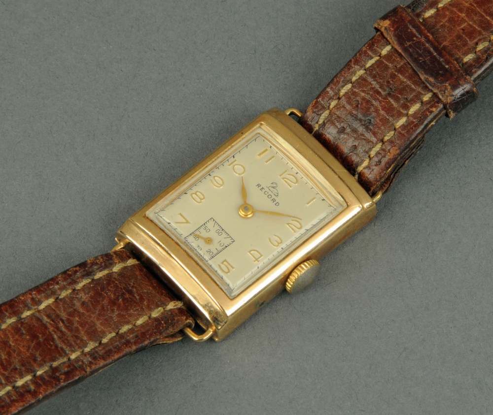 A gentleman's Art Deco Record wristwatch, in 9 ct gold rectangular case, leather strap.