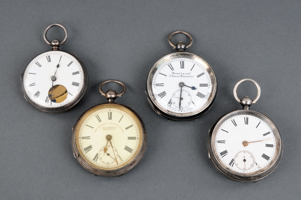 A collection of four gentleman's silver pocket watches.