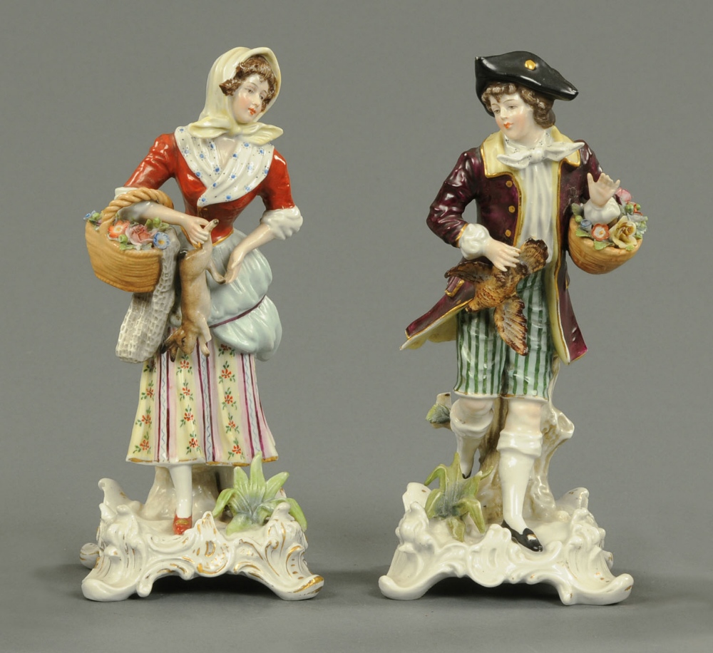 A pair of Naples figurines, lady and gentleman, polychrome.  Height 9 ins (see illustration).