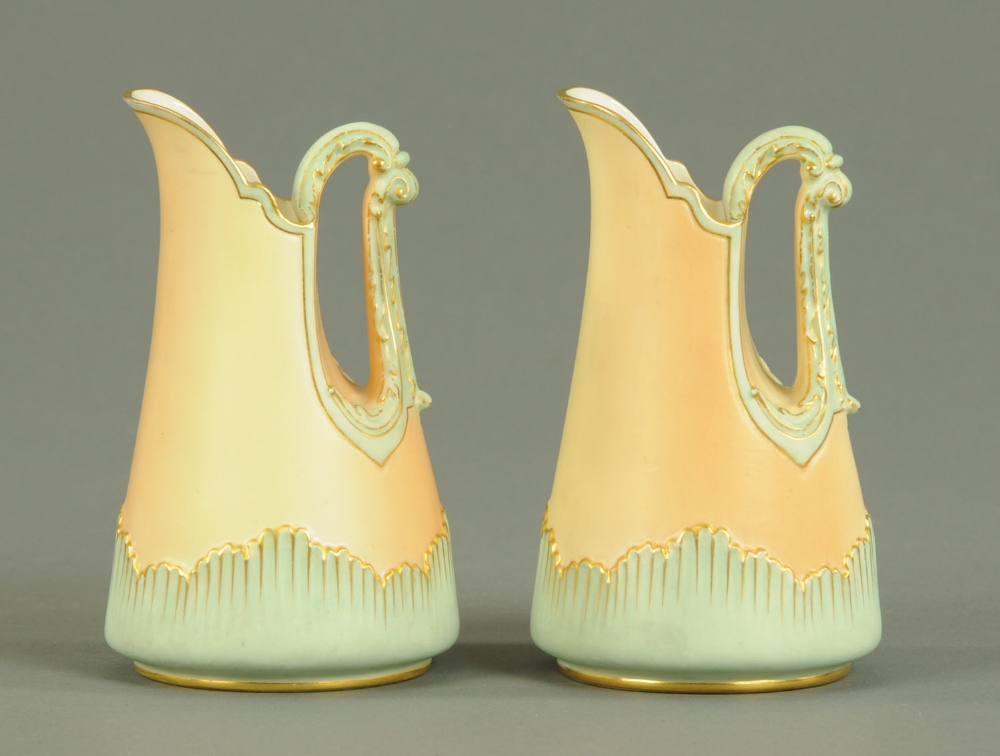 A pair of Worcester tusk jugs, Model No. 1546, puce printed mark.  Height 5 ins.