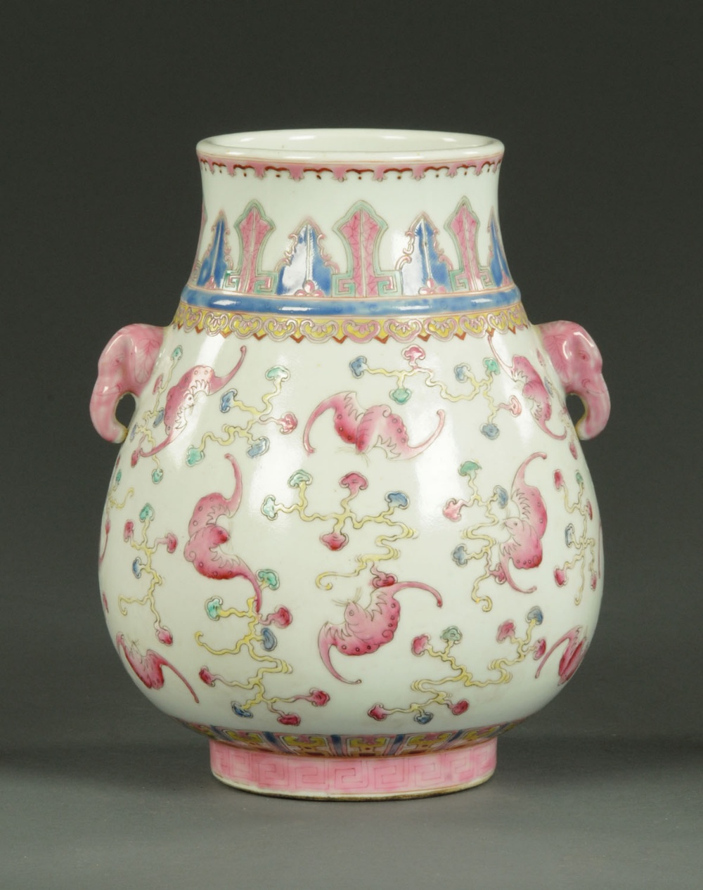 A Chinese Famille Rose vase, with elephant mask handles, the body decorated with flying bats,