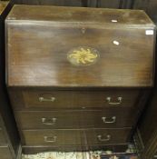 A mahogany three drawer bureau with satinwood floral inlay motif to central panel, on bracket feet