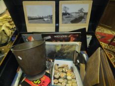 A tin trunk and contents of assorted items to include two black and white photographs with labels