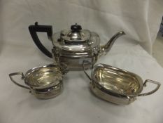 A George V silver three piece tea set comprising teapot, cream jug and sucrier (by Emile Viner,