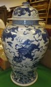 A Chinese blue and white baluster shaped vase and cover with kylin decoration