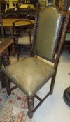 A set of six mid 20th Century oak dining chairs with upholstered seat and back, raised on cup and