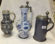 A Dutch Delft blue and white flagon with pewter mounts, a Dutch Delft tankard with pewter mounts and