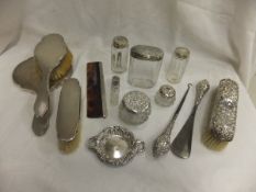 A mid 20th Century silver backed dressing table set comprising hand mirror, clothes brush, hairbrush
