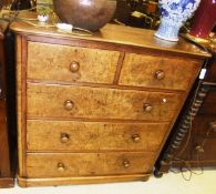 A Victorian burr walnut chest of two short and three long graduated drawers with turned knob handles