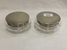 A pair of mid 20th Century silver mounted cut glass dressing table jars (Birmingham, 1959)