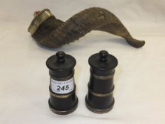 A pair of ebony and silver mounted pepper grinders (by M.C. Hersey & Son Ltd., London) together with