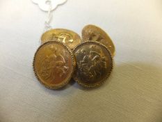 A pair of cufflinks made from two half sovereigns and other yellow metals, the backs inscribed "