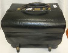 A black leather doctor's case, marked "Bests, 188 Sloane Street", together with a pair of binoculars