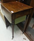 A 19th Century mahogany Pembroke work table on reeded legs to brass castors   CONDITION REPORTS