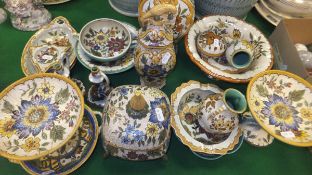 A collection of six 20th Century Gouda pottery wares with floral spray decoration