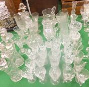 A selection of glassware to include wine glasses, two decanters (one with silver rim), a jug, some