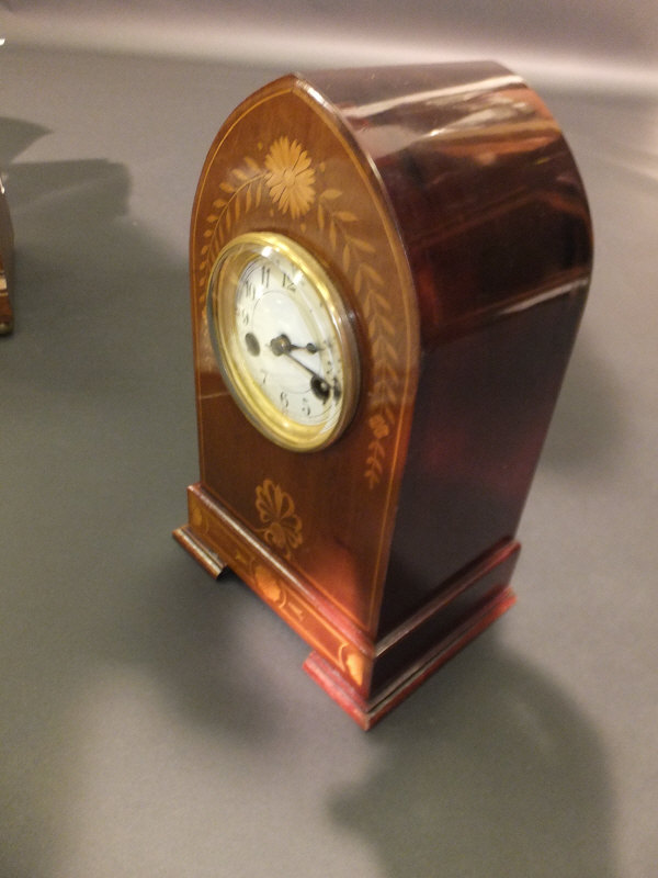 A circa 1900 French mahogany and inlaid cased mantel clock of lancet form, the eight day movement