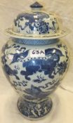 A Chinese blue and white baluster shaped vase and cover with kylin and ball decoration