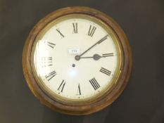A Victorian oak cased wall dial or school clock, the eight day movement with circular painted dial