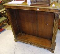 A 20th Century walnut open bookcase in the 18th Century manner, the cross-banded top with moulded