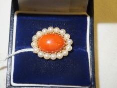 A 9 carat yellow gold, coral and sixteen cultured pearl oval cluster brooch (London 1983, sponsor'