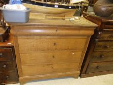 A late 19th Century Continental light oak commode of four graduated drawers on bracket feet
