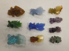 A collection of ten 1920's Chinese carved miniature fish of glass, stone and jade