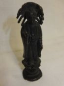 A Chinese bronze figure of Guan Yin stood upon a lotus flower
