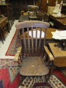 A late 19th Century beech and elm stick back carver chair