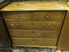 A 19th century ash and elm chest of two short and three long graduated drawers with brass handles