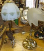 An adjustable brass table lamp on circular base, and a brass candlestick style table lamp on