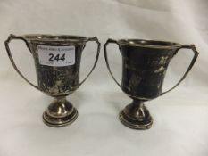 Two mid 20th Century silver twin-handled trophy cups (London, 1947), both inscribed "Vincent