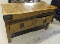 A large rectangular beech butcher's block with two drawers below, bears label inscribed "