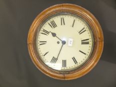 An early 20th Century oak cased wall dial or school clock, the eight day movement with circular