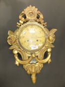 A 20th Century Swedish cartel clock in carved giltwood case, the eight day movement by A B