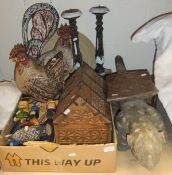 A box of assorted wooden figures to include guinea fowl, cockerel, etc, a pair of pricket sticks and