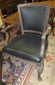 A set of six early 20th Century oak dining chairs with carved acanthus decoration and black