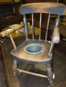 A 19th Century beech and elm child's commode chair