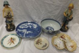 A 19th Century Chinese porcelain bowl decorated in underglaze blue with figures and pagodas in a