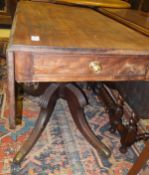 A Regency mahogany drop-leaf pedestal Pembroke table with drawers to either end