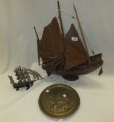 An Oriental model of Chinese junk, another model of tall masted ship and a brass plaque decorated