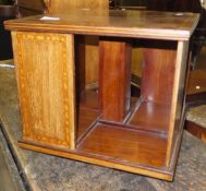 An Edwardian mahogany and satinwood strung small table top revolving bookcase