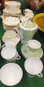 A collection of Royal Albert Crown china Art Deco coffee wares, a Belleek cup and saucer in the form