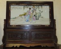 A 20th Century Chinese porcelain table screen decorated with lady and children with toad on a string